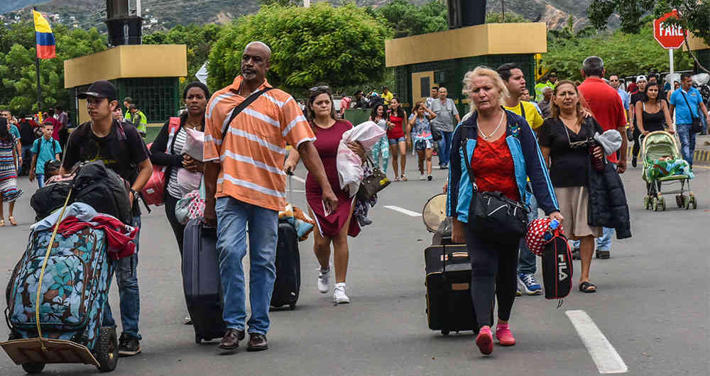 Venezolanos en el Cesar y Caribe estarían retornando a su país, según cifras de Migración Colombia. Foto: AFP.