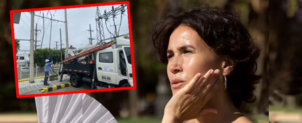 Afinia y mujer refrescándose con abanico de mano.