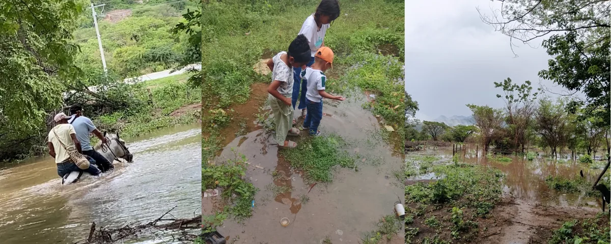 Campesinos de la vereda Renacer atraviesan sus tierras tras el desbordamiento de agua.